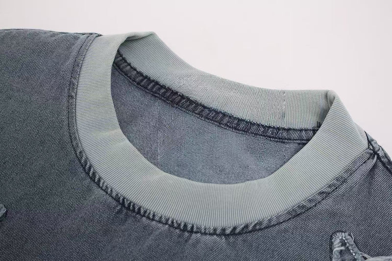 Vintage washed gray t-shirt with ribbed crew neck and distressed star patch detail on the chest