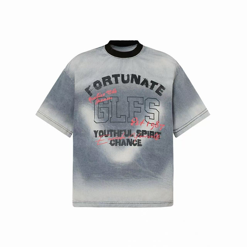 Vintage washed gray graphic T-shirt with spray-fade print, black collar, and bold streetwear lettering on front