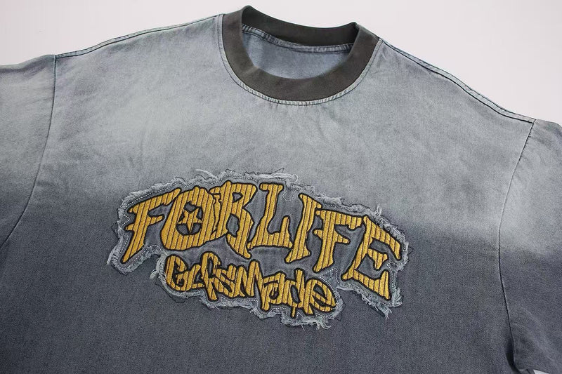 Vintage washed gray T-shirt with distressed yellow FOR LIFE graphic embroidery and ribbed black crew neck