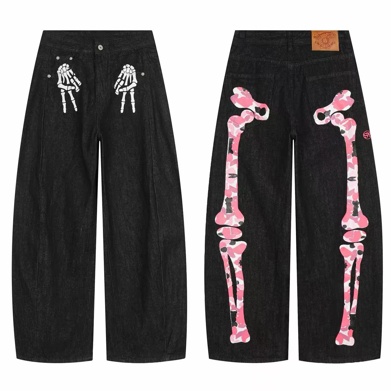 Front and back view of black wide-leg denim pants with white skeleton hand prints on front and pink camo bone graphics on bac