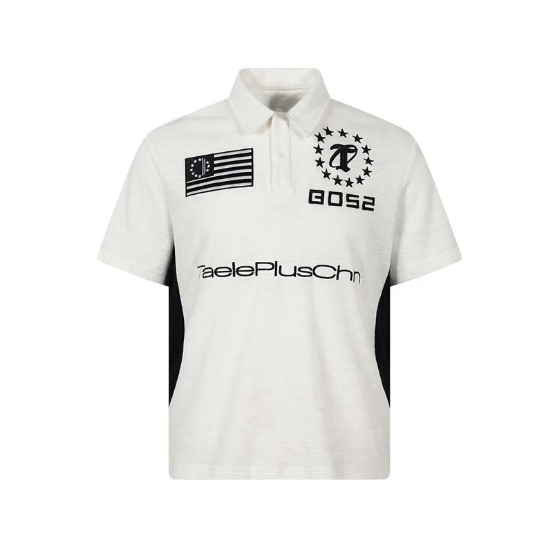 White short-sleeve varsity polo shirt with black side panels, logo patches, and a buttoned collar