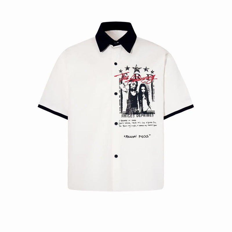 White oversized button-up shirt with black collar and sleeve trim, featuring a bold grunge graphic print on the chest