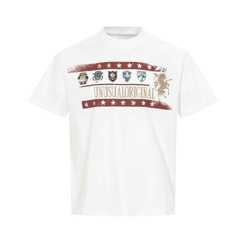White vintage graphic T-shirt with crest-style emblems, red star stripes, and Unusual Original text print on chest