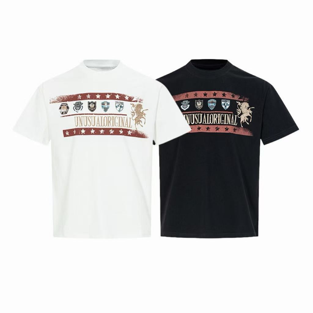 White vintage crest graphic t-shirt with distressed red stripe, shield emblems, and Unusual Original typography on chest