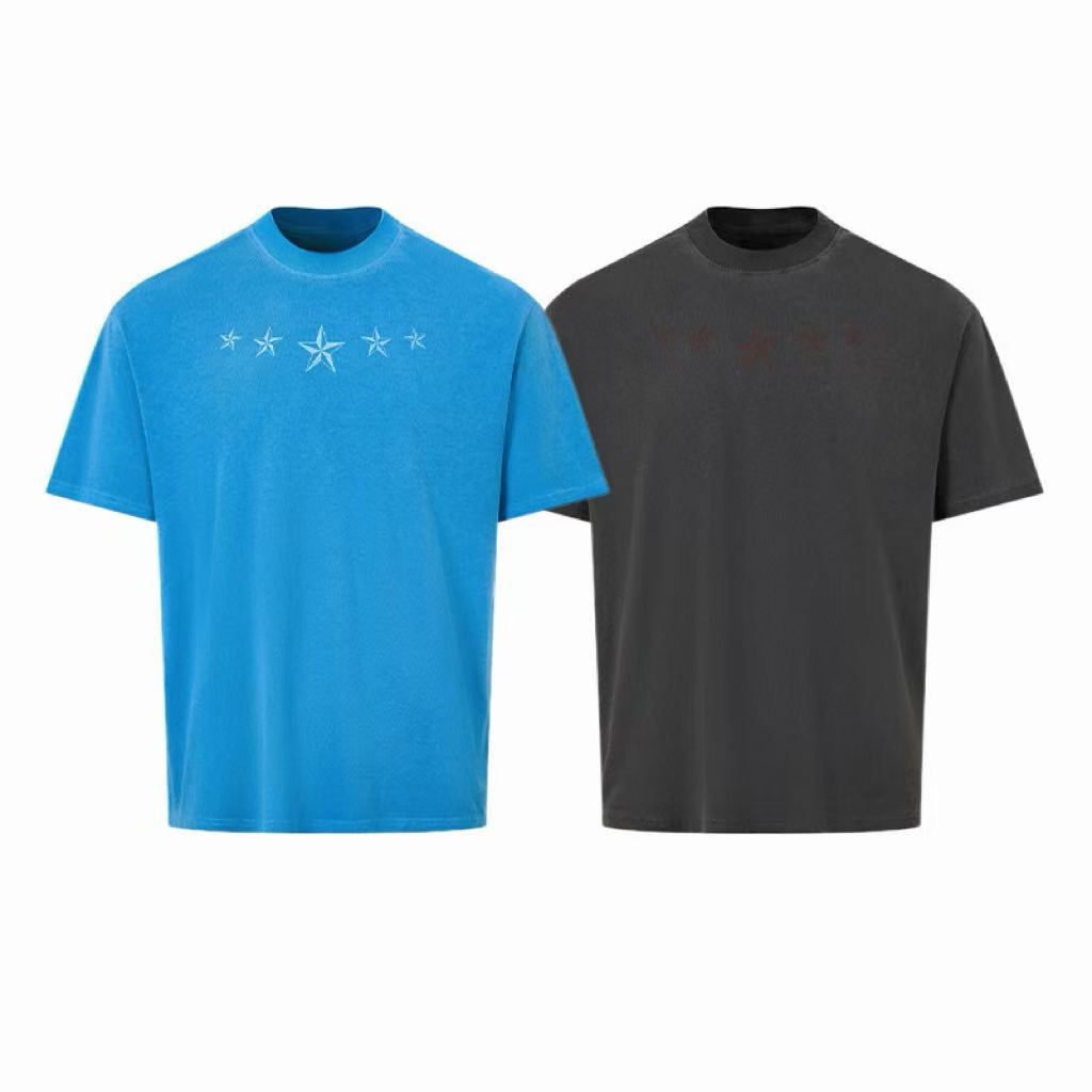 Oversized blue vintage-washed cotton t-shirt with tonal embroidered nautical stars across the chest