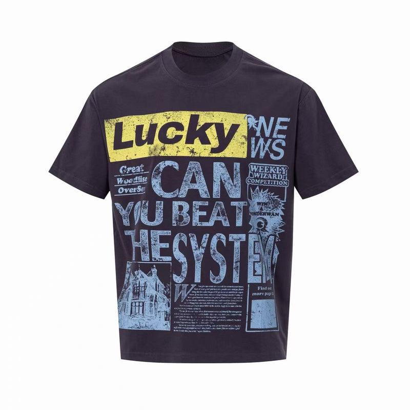 Black oversized graphic tee with Lucky newspaper print and bold CAN YOU BEAT THE SYSTEM lettering