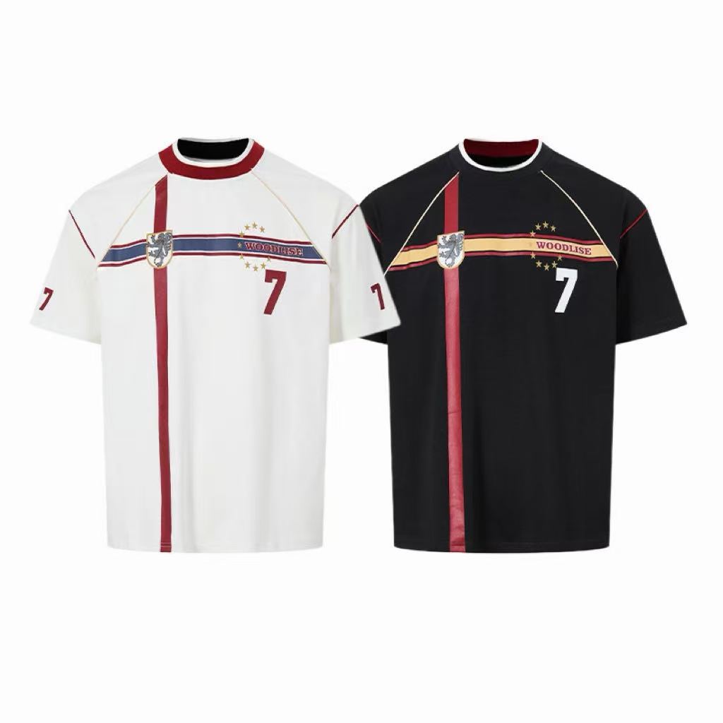 White and black oversized retro football jersey t-shirts with vintage lion crest graphic and number 7 print