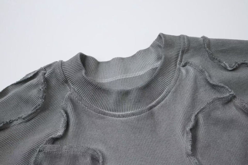 Gray ribbed raw seam compression tee with deconstructed stitching and distressed streetwear detailing