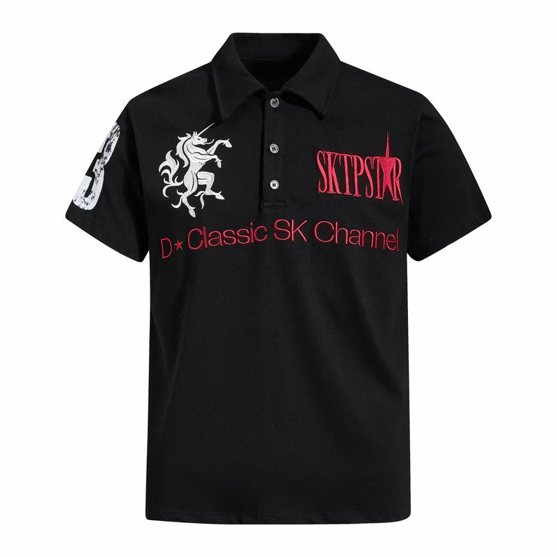 Black streetwear polo shirt with red SK Channel graphics, white unicorn emblem, and buttoned collar