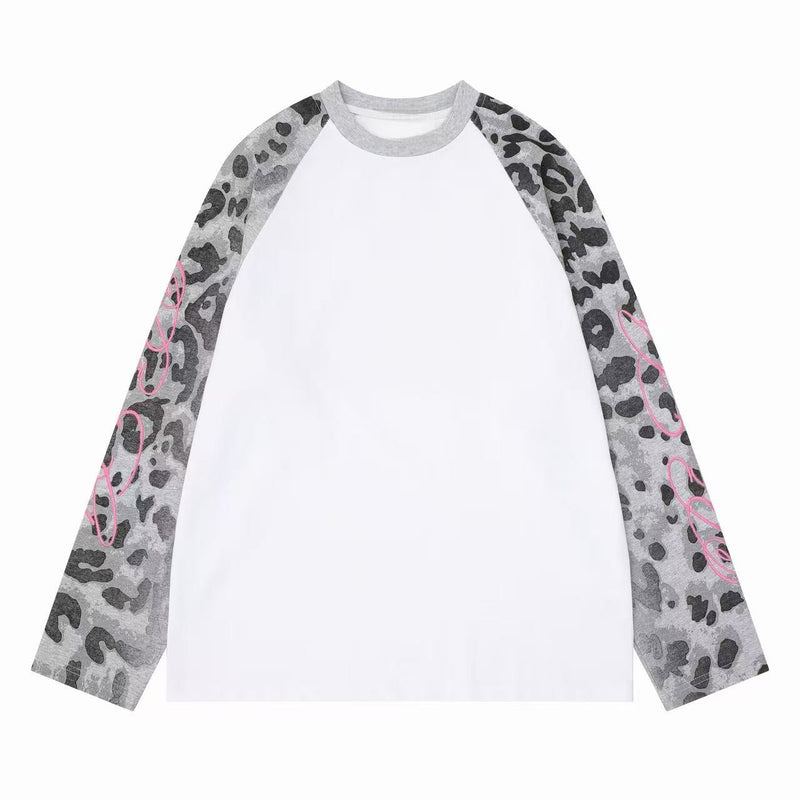 White raglan long sleeve tee with gray leopard-print sleeves and pink script detail