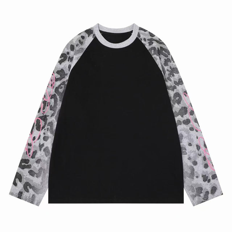 Black body raglan long sleeve tee with gray leopard-print sleeves and pink script detail