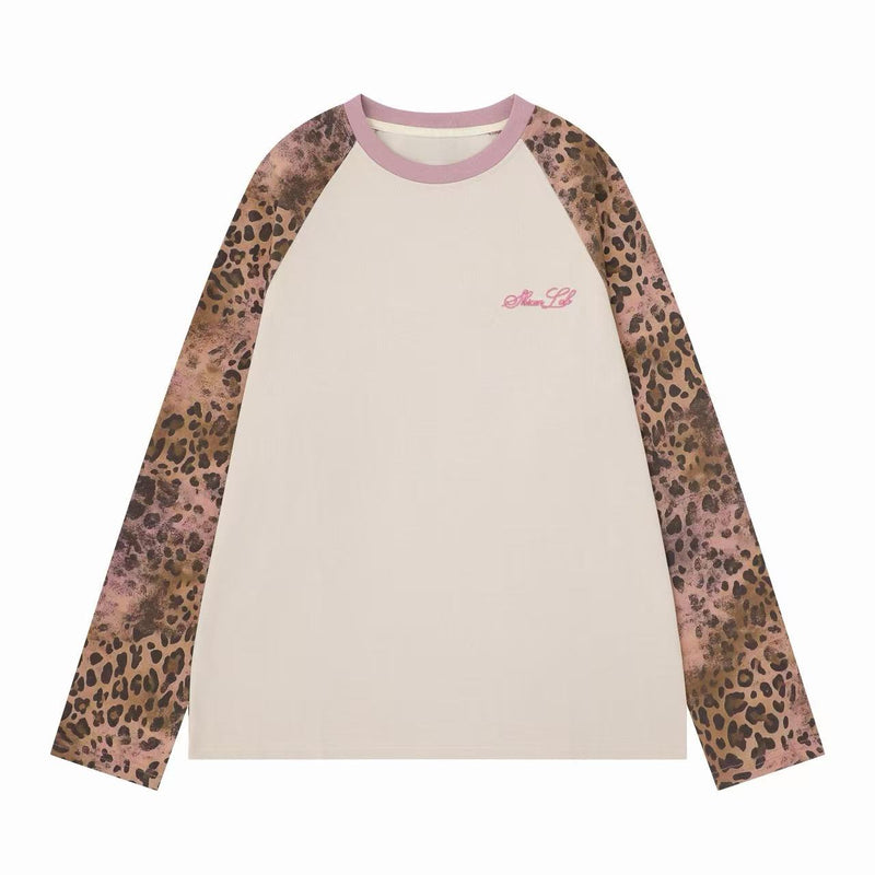 Cream raglan long sleeve tee with pink ribbed collar and leopard print sleeves, front view