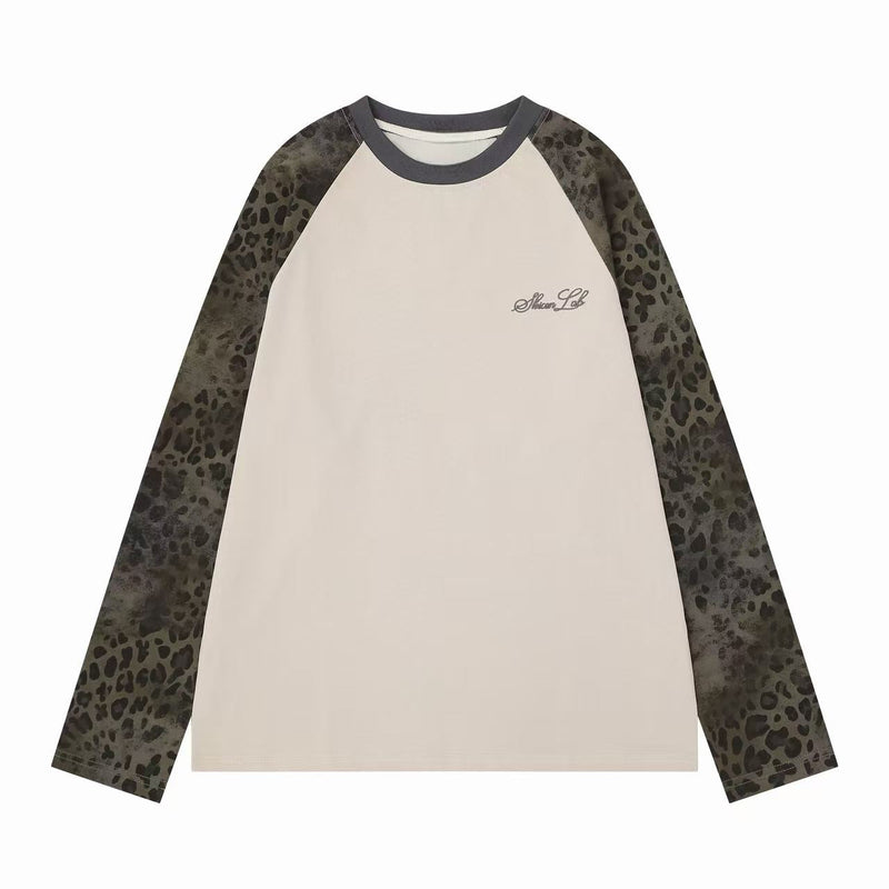 Cream raglan long sleeve tee with dark gray collar and leopard print sleeves, front view