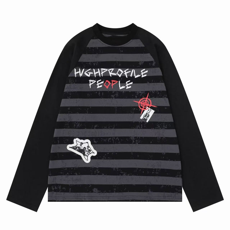 Black raglan long sleeve tee with gray stripes, graffiti-style graphics, and chest patches
