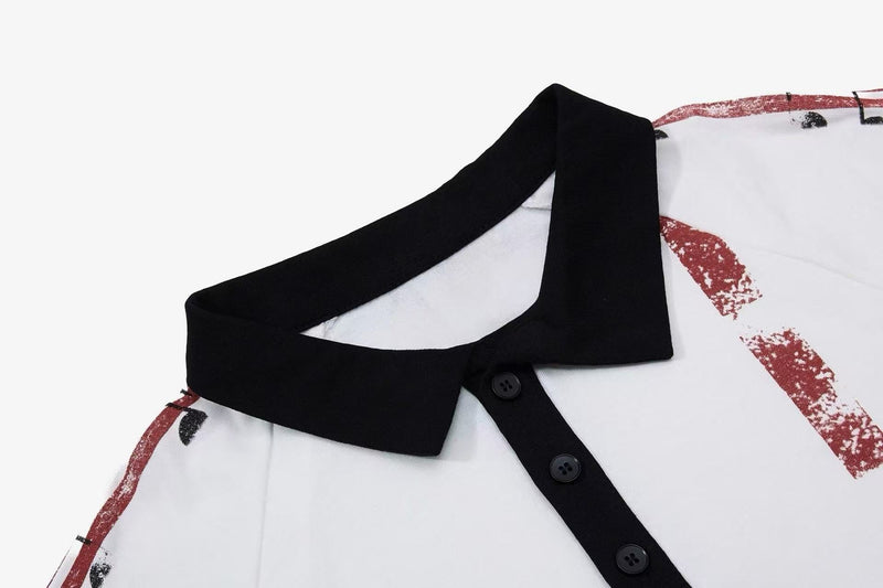 Close-up of a white men’s polo shirt with black collar and placket, featuring a distressed red music graphic print