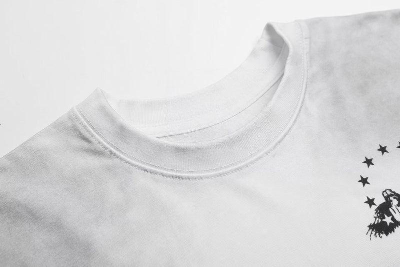 White crewneck graphic T-shirt with black star collage print and vintage Y2K streetwear style