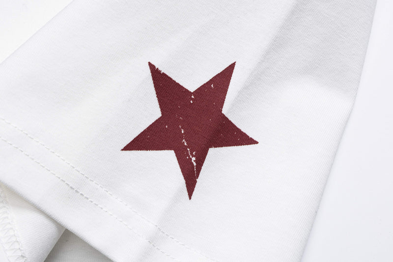 White streetwear tee with a distressed burgundy star graphic on soft cotton fabric detail