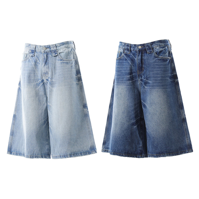 Vintage wash wide-leg denim shorts shown in light and dark blue front views