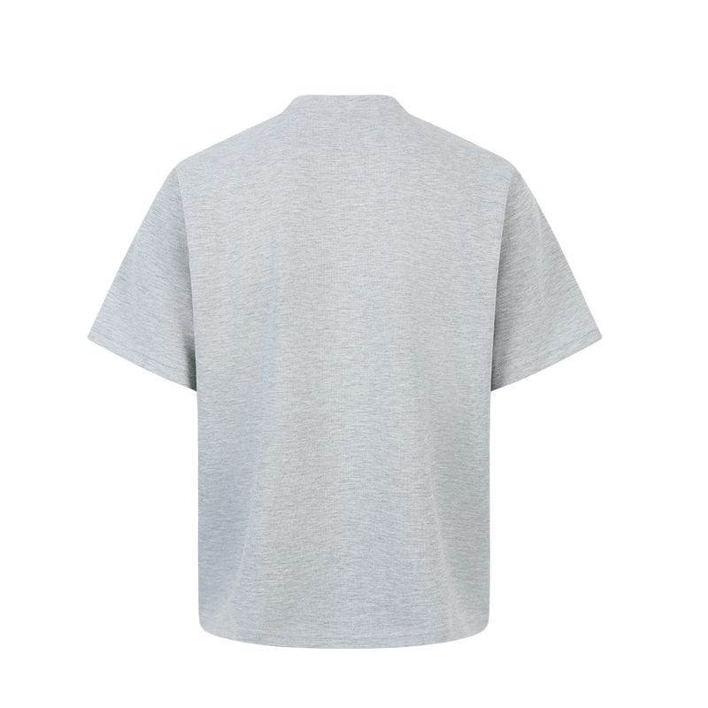 Light gray oversized short-sleeve tee with relaxed fit and subtle asymmetrical seam detailing