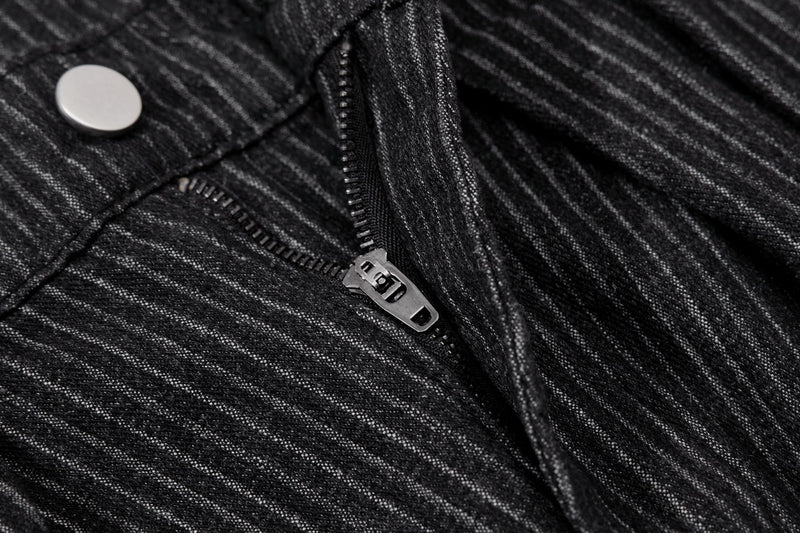 Close-up of black pinstripe trouser fly with zipper and button