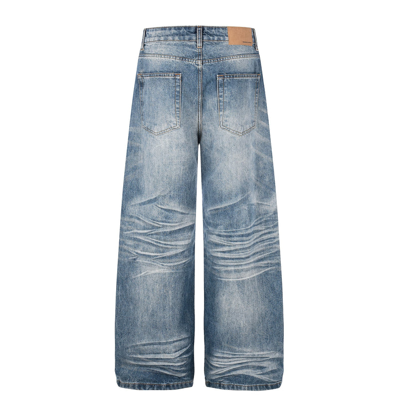 Back view of faded blue wide leg jeans with patch label and two back pockets
