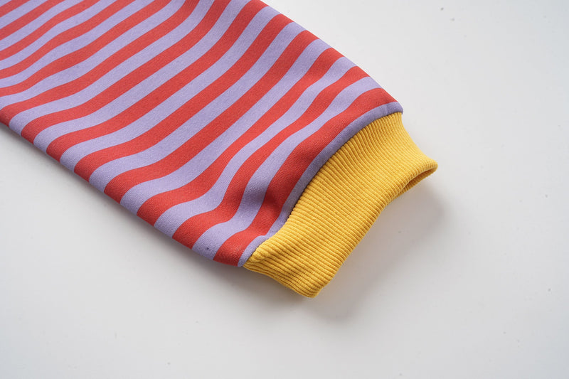 Striped sleeve cuff with yellow ribbed knit trim