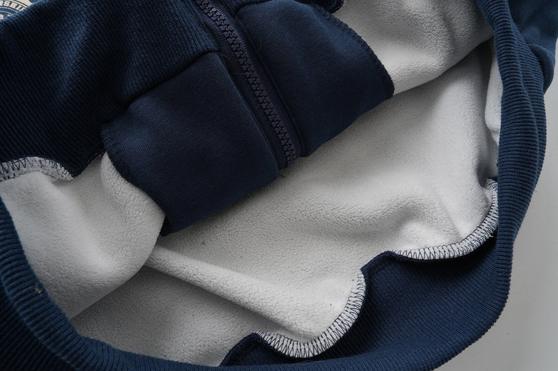 Interior view of navy fur-lined hood with white fleece lining