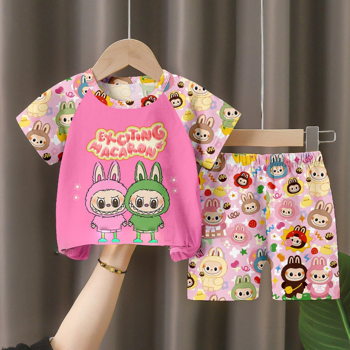 Displayed is a LABUBU Baby Pajama Set - Colorful Milk Silk Kids Sleepwear. Featuring the &quot;Exciting Macaron&quot; design, it&