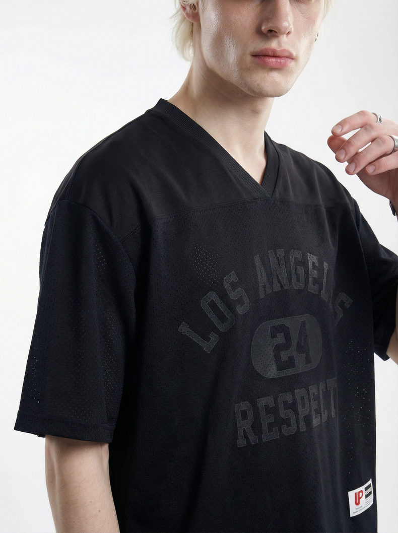 Black V-neck mesh tee with faded Los Angeles 24 Respect graphic on the front, worn by a model