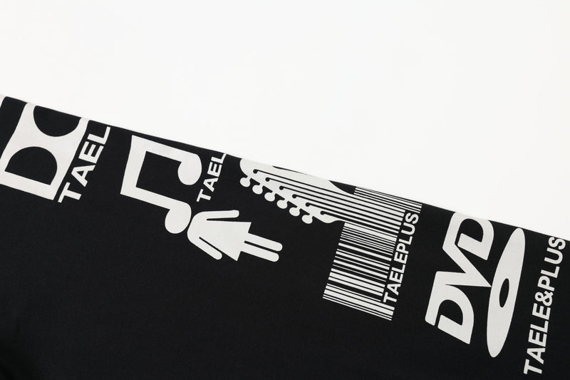 Close-up of black sleeve showing white music note and text graphics