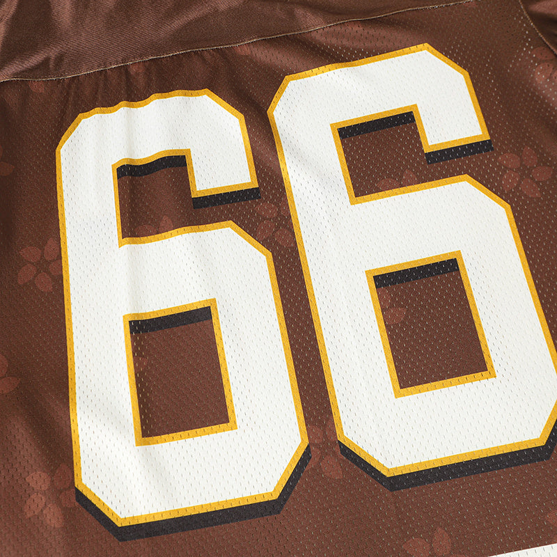Brown varsity football jersey with large white number 66 and gold trim on a textured mesh fabric