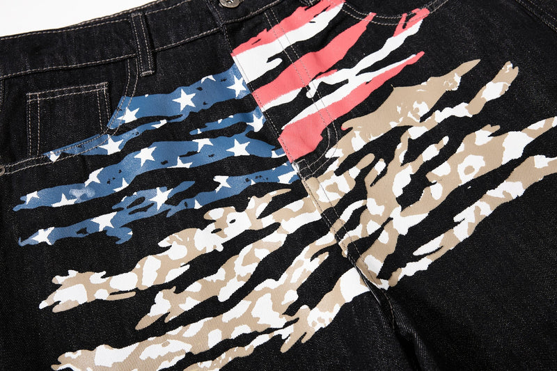 Close-up of front American flag print across black wide-leg jeans