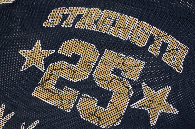 Black mesh football jersey close-up with gold Strength 25 graphic and star accents on the chest