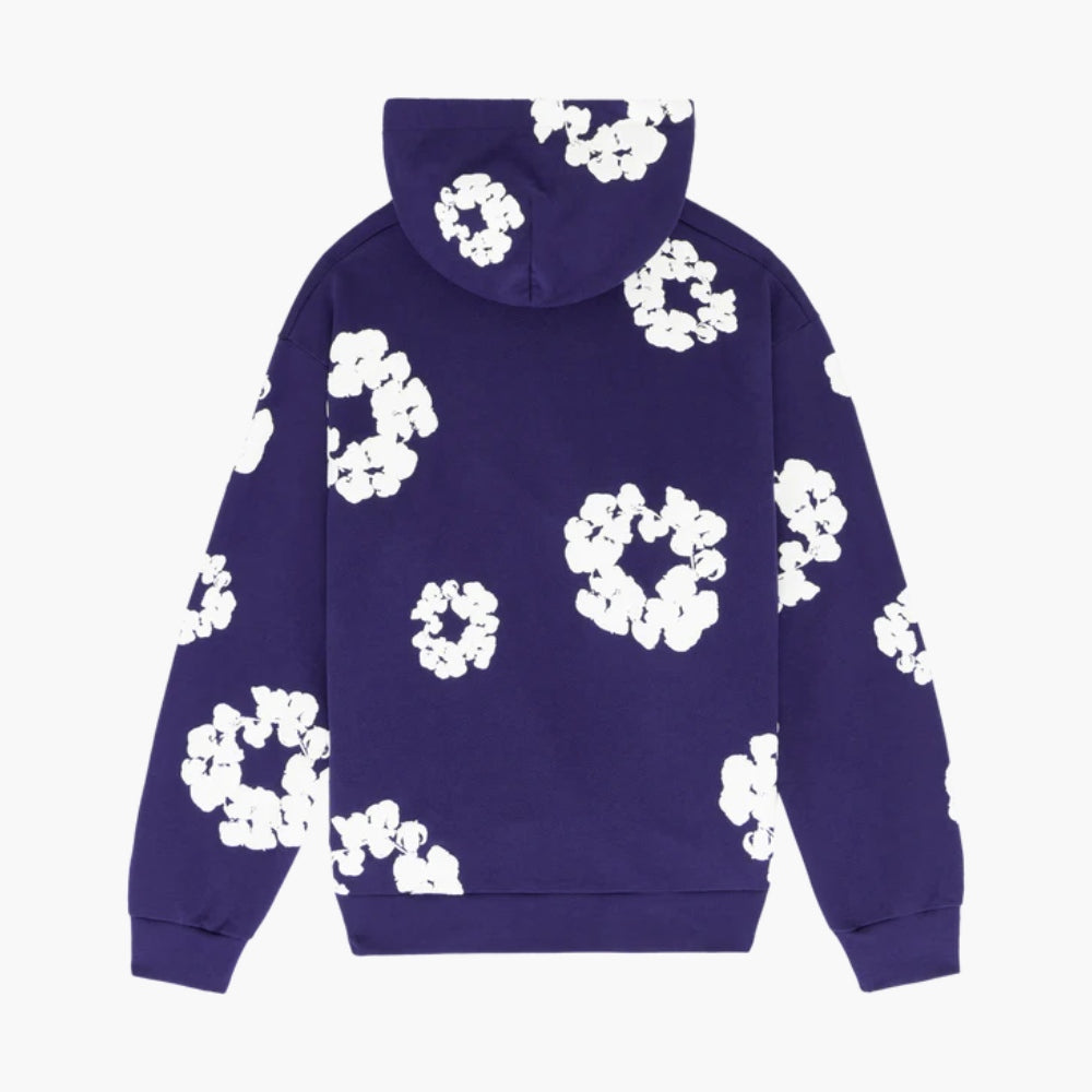 The Purple “Cotton Wreath” Denim Tears Hoodie is a streetwear pullover featuring a hood and white floral print, inspired by the signature Denim Tears design.