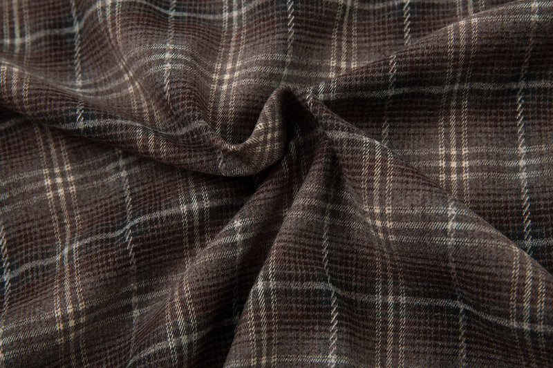 Close-up of gathered brown plaid fabric texture