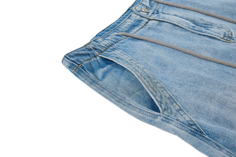 Close-up of side seam and pocket opening on vintage wash denim jeans