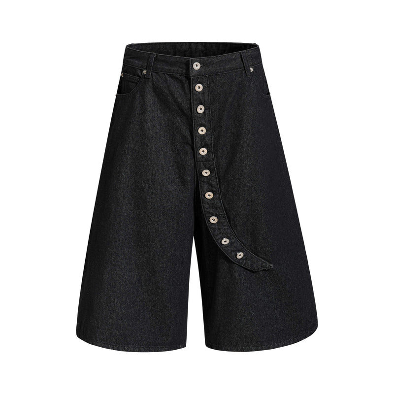 Front view of black wide-leg denim shorts with asymmetrical button placket