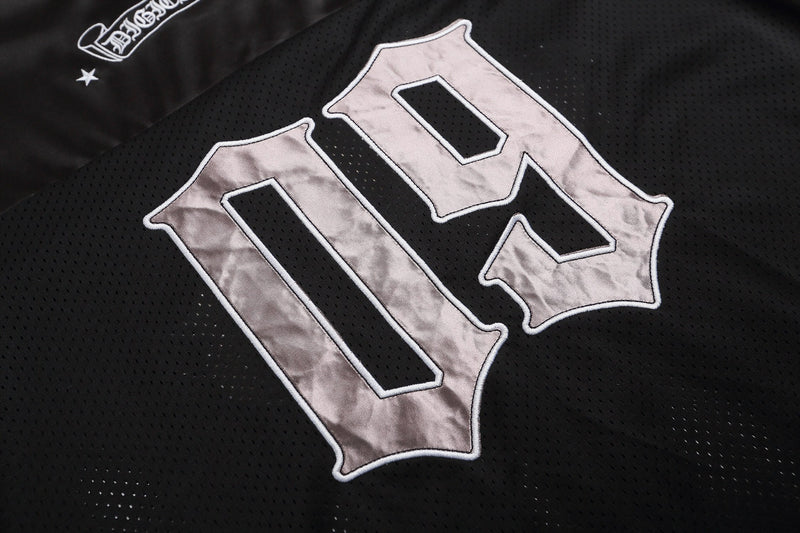 Black mesh football jersey with oversized silver gothic lettering and star detail on the chest