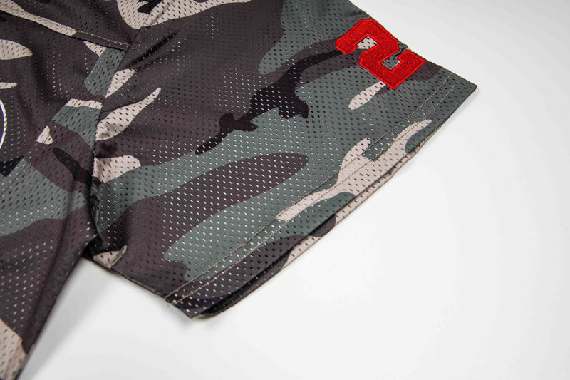 Camo mesh football jersey tee sleeve with red number patch and oversized streetwear styling