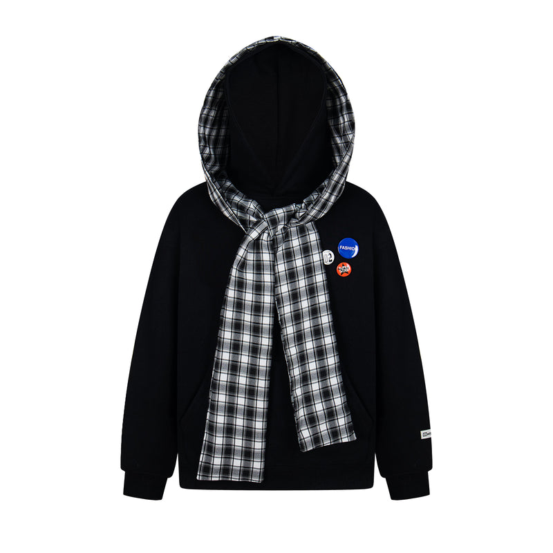 Front view of black hoodie with black-and-white plaid hood, tied scarf, and badge accents