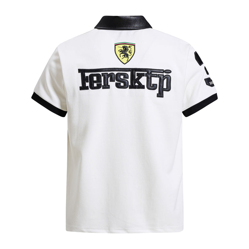 White polo shirt with black collar and trim, featuring a large Ferrari-style crest graphic on the back