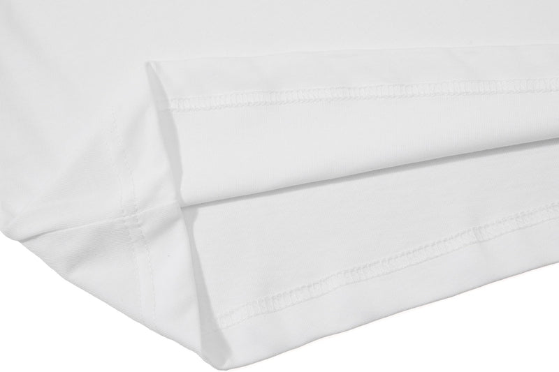 Close-up of a white polo tee sleeve with neat double stitching and smooth streetwear fabric texture