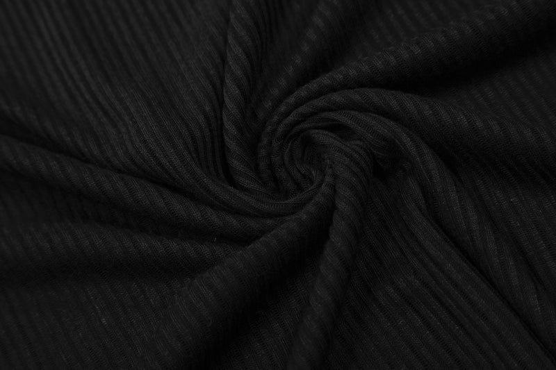 Close-up of black ribbed knit fabric gathered into a swirl