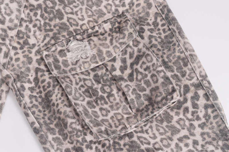 Cargo pocket close-up on leopard print denim pants with distressed detail