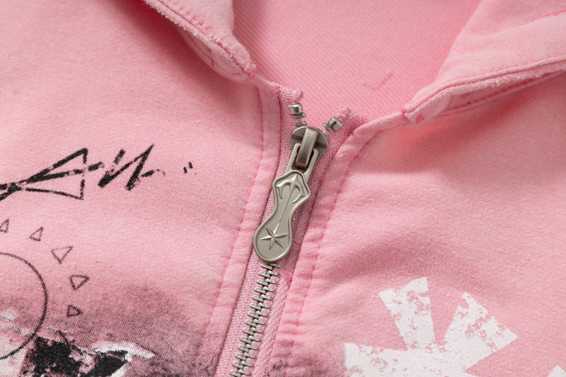 Close-up of silver zipper on pink zip hoodie front