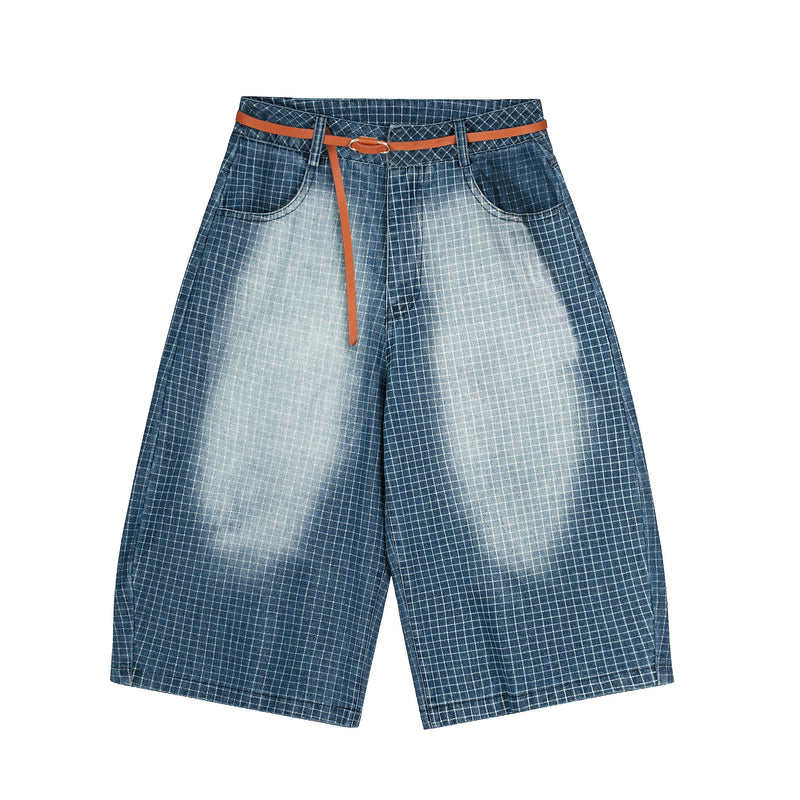 Front view of washed blue grid denim shorts with orange belt and wide legs