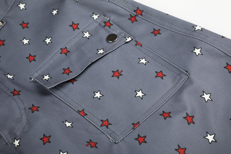 Close-up of gray star print cargo pocket with flap and snap button