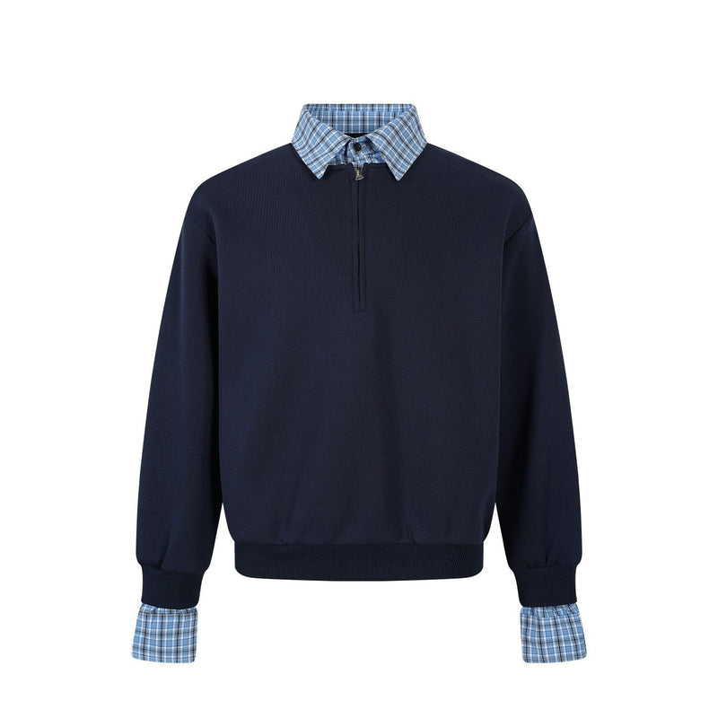 Front view of navy half-zip pullover with blue plaid collar and plaid cuffs
