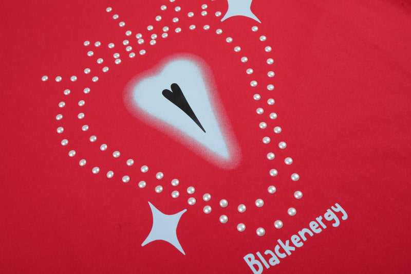 Red graphic tee with rhinestone-dotted heart design, black center accent, and Blackenergy text detail