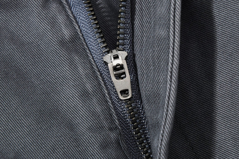 Close-up of dark gray zipper fly on wide-leg pants